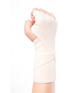 Beige elastic support bandage, 5 cm X 5 m (2 in X 16 ft).