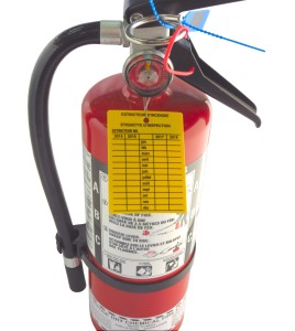 Yellow plastic monthly inspection tag for fire extinguishers, labelling in French, covering 4 years.