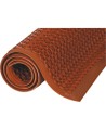 Red carpet 1/2 in, made of vulcanized rubber with cylindrical flow openings and rising grooves.